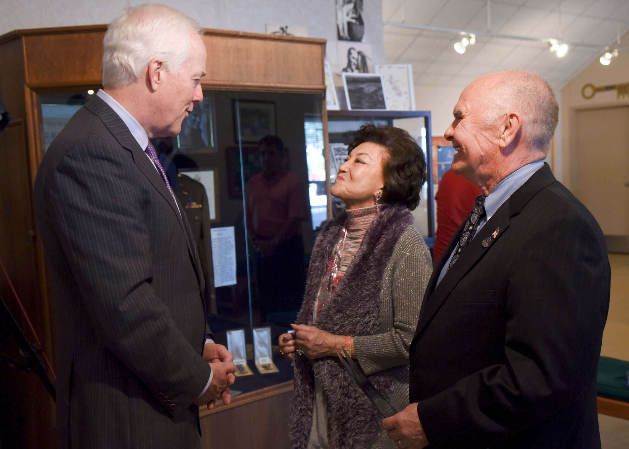 U.S. Sen. John Cornyn, R-TX, shares a moment with Dr. Stanley Scott Jr., son of U.S. Army Air Corps pilot Capt. Stanley Scott Sr., and his wife, Diana Scott, at the Dyess Museum in Abilene, Texas, April 18, 2017. Cornyn presented the POW medal to the Scott family on behalf of Scott Sr. (U.S. Air Force photo by Senior Airman Kedesha Pennant)
 
