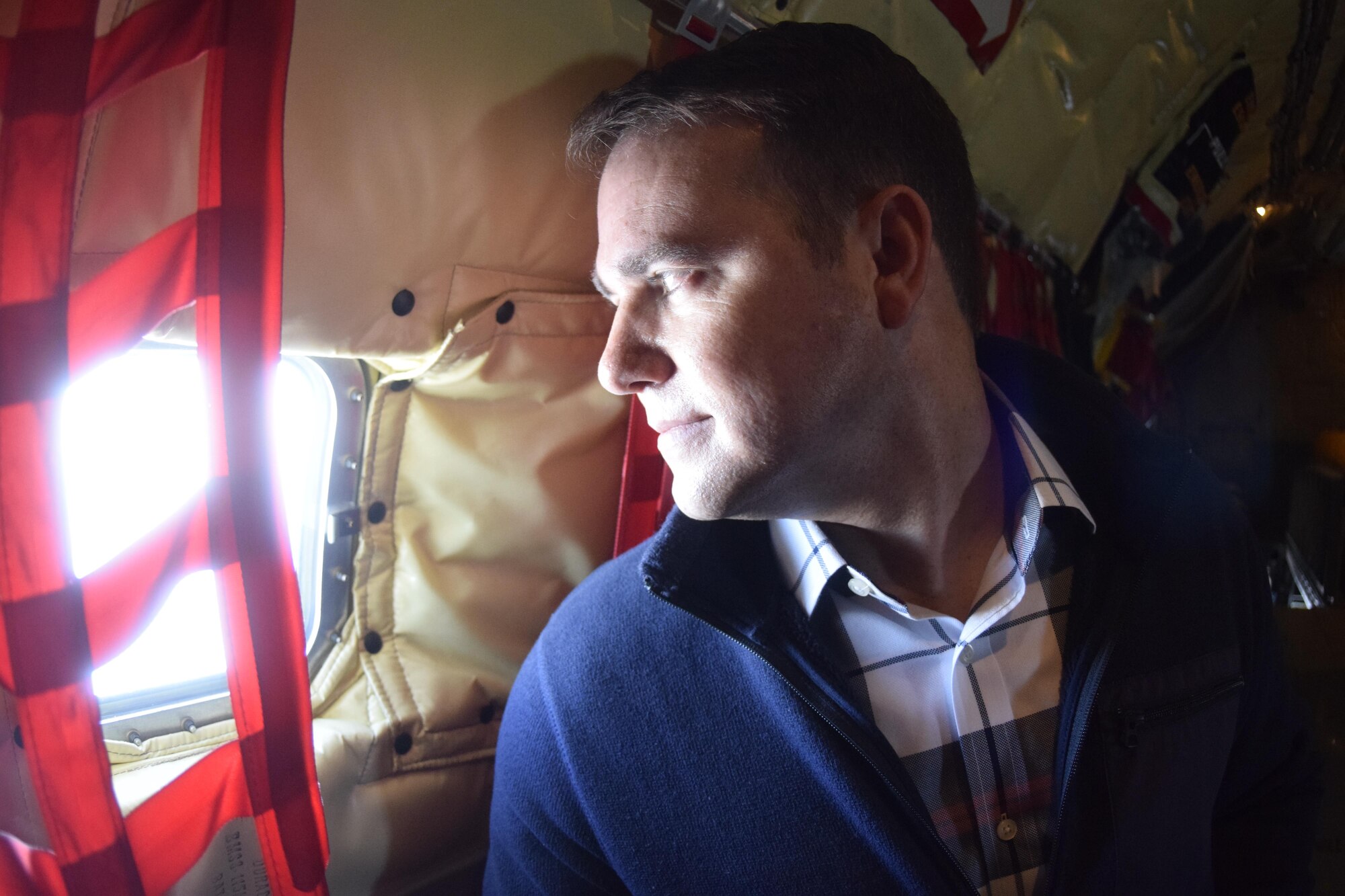 Lane Neal, a member of the Tinker Air Force Base Honorary Commander's 2017 Class, looks out a fuselage window of a KC-135R Stratotanker of the 507th Air Refueling Wing, Air Force Reserve Command, during a local training flight April 6, 2017, from Tinker Air Force Base, Oklahoma. The Honorary Commander's learned about the KC-135R Stratotanker's mission during an air refueling mission with F-16s of the 138th Fighter Wing, Oklahoma Air National Guard. (U.S. Air Force photo/Greg L. Davis)