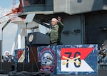 Vice President Michael R. Pence waves to service members on the flight deck of the Navy's forward-deployed aircraft carrier, USS Ronald Reagan (CVN 76), April 19, 2017. The vice president's tour of the ship and his remarks to U.S. and Japanese service members highlighted the administration's continuing commitment to rebuilding the U.S. military and to its alliances in the region. Ronald Reagan, the flagship of Carrier Strike Group 5, provides a combat-ready force that protects and defends the collective maritime interests of its allies and partners in the Indo-Asia-Pacific region.
