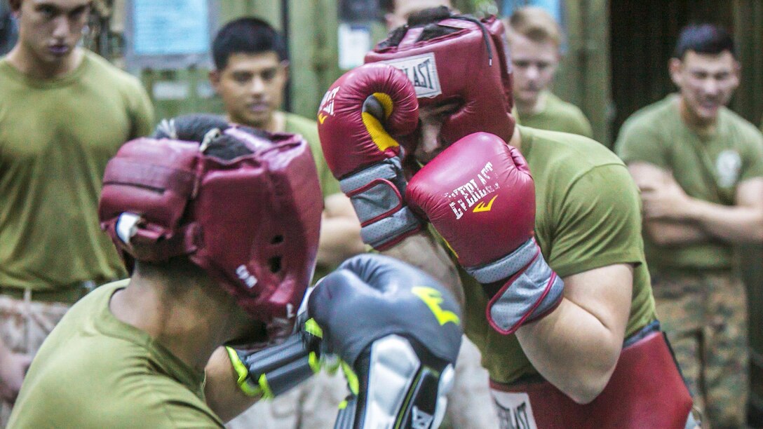 A Marine blocks a jab from a fellow Marine during a Marine Corps Martial Arts Program training session aboard the USS Somerset at sea in the U.S. 7th Fleet area of responsibility, April 13, 2017. Marine Corps photo by Xzavior T. McNeal