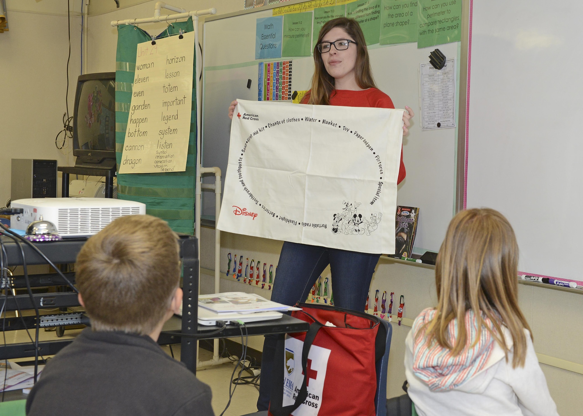 American Red Cross representative Haley Seibel talks to third-graders at Irving L. Branch Elementary April 11 about the Red Cross’ Pillowcase Project. Subjects touched on included managing stress during an emergency; what to do in case of a fire or earthquake; and what items the children should pack during an emergency in their pillowcase. (U.S. Air Force photo by Kenji Thuloweit)