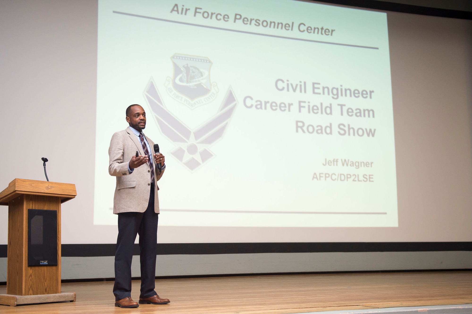 Jabuaar Rorie, Air Force Personnel Center Civil Engineer career field advisor, speaks to an audience at the base theater April 6. Rorie was part of a two-man team who visited Edwards as part of the Civil Engineer Career Field Team Road Show, which provides insight to CE personnel on career management and development. (U.S. Air Force photo by Ethan Wagner)