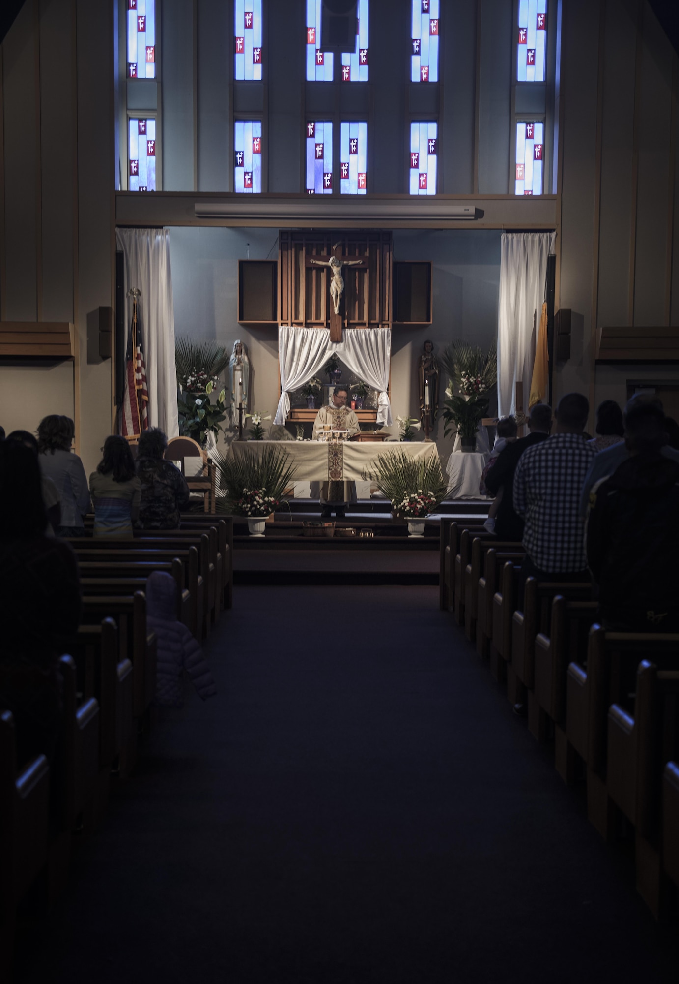 Father Juan Salonga, 92nd Air Refueling GS Catholic Priest, leads a catholic Easter service April 16, 2017, at Fairchild Air Force Base, Washington.  The chaplain corps exists to support free exercise of religion according to the First Amendment of the Constitution of the United States of America. At each base, chaplains support the religious freedom of Airmen and their families and help with spiritual resilience. (U.S. Air Force photo/Airman 1st Class Sean Campbell)