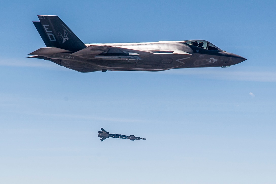 An F-35C from the 461st Flight Test Squadron at Edwards Air Force Base, California, releases a GBU-12 Paveway II guided bomb March 29. The inert bomb tracked a moving pickup truck on the ground at Naval Air Weapons Station China Lake in California. The fifth-generation fighter was flown by Col. Scott Cain, 412th Operations Group commander. (Courtesy photo by Darin Russell/Lockheed Martin)