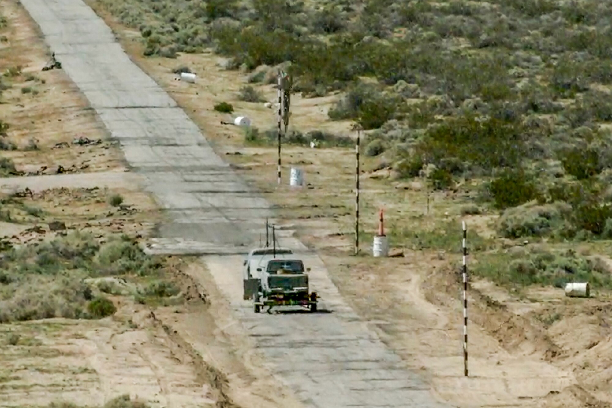 A GBU-12 Paveway II guided bomb is about to strike a computer-driven small pickup truck during a test at Naval Air Weapons Station China Lake, California. The inert bomb was dropped from an Edwards F-35C. (Image courtesy of Lockheed Martin)