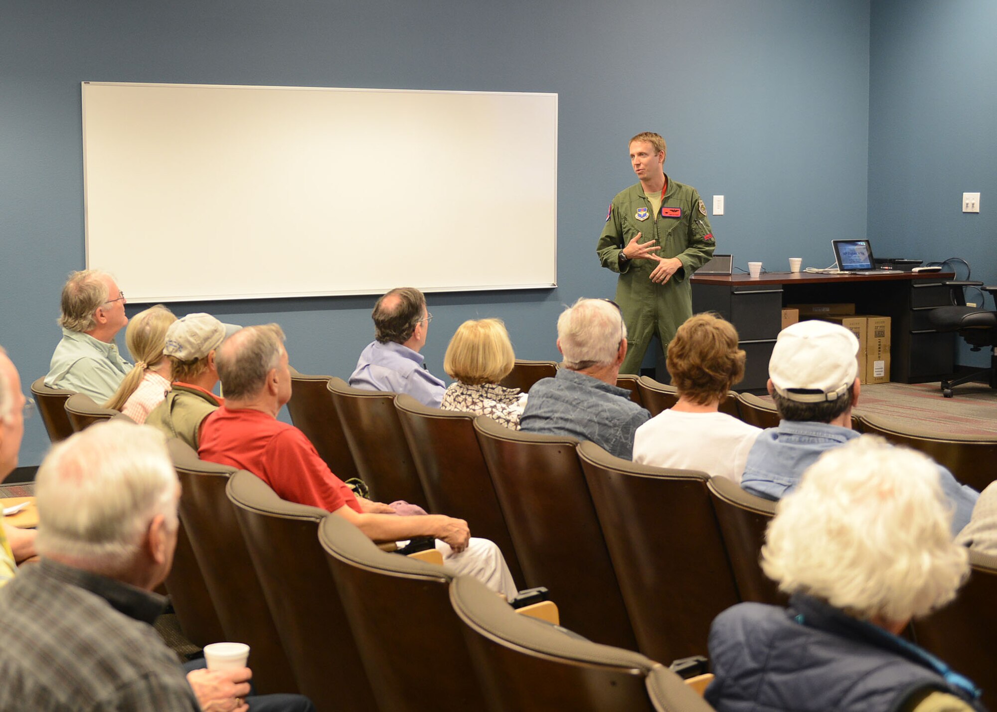 Maj. Hunter Powell, 63rd Fighter Squadron F-35 Lightning II instructor pilot, gives a mission brief to the Undergraduate Pilot Training class of 1967 April 12, 2017, at Luke Air Force Base, Ariz. The group visited the squadron as part of their 50-year reunion. (U.S. Air Force photo by Senior Airman James Hensley)