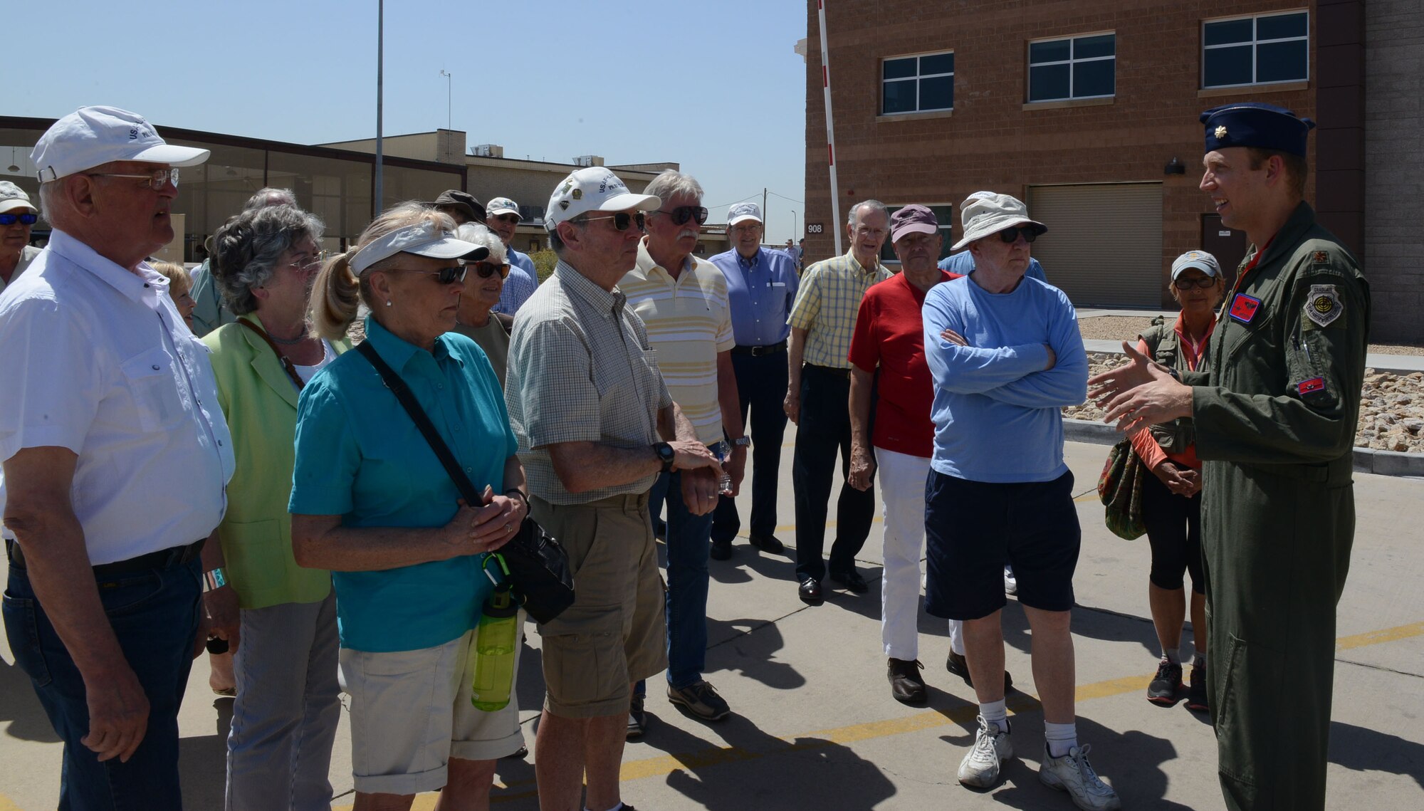 Maj. Hunter Powell, 63rd Fighter Squadron F-35 Lightning II instructor pilot, talks to the Undergraduate Pilot Training class of 1967 about how F-35 pilots train at Luke Air Force Base, Ariz. The pilots visited the 63rd FS April 12, 2017 and were briefed on what the F-35 does at Luke and how it impacts the Air Force. (U.S. Air Force photo by Senior Airman James Hensley)