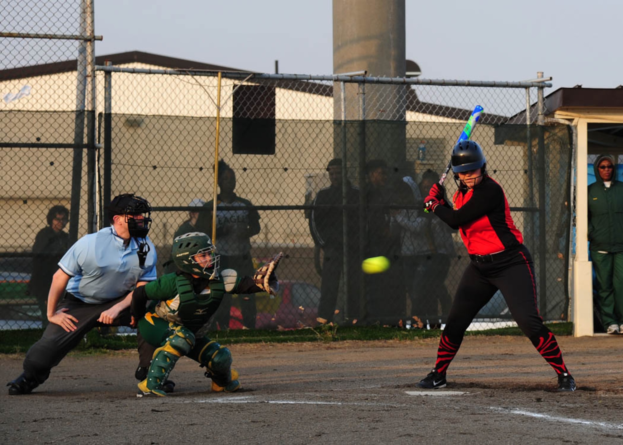 Sabrina, daughter of SMSgt Vincent Doria, 35th Maintenance Group quality insurance inspector, catches a fast pitch softball as a batter from Nile C. Kinnick High School watches it fly through the strike zone during a weekend competition on Misawa Air Base, Japan, April 14, 2017.  Sabrina is one of two team captains leading the Robert D. Edgren Lady Eagles softball team through the season. (U.S. Air Force photo by Tech. Sgt. April Quintanilla)