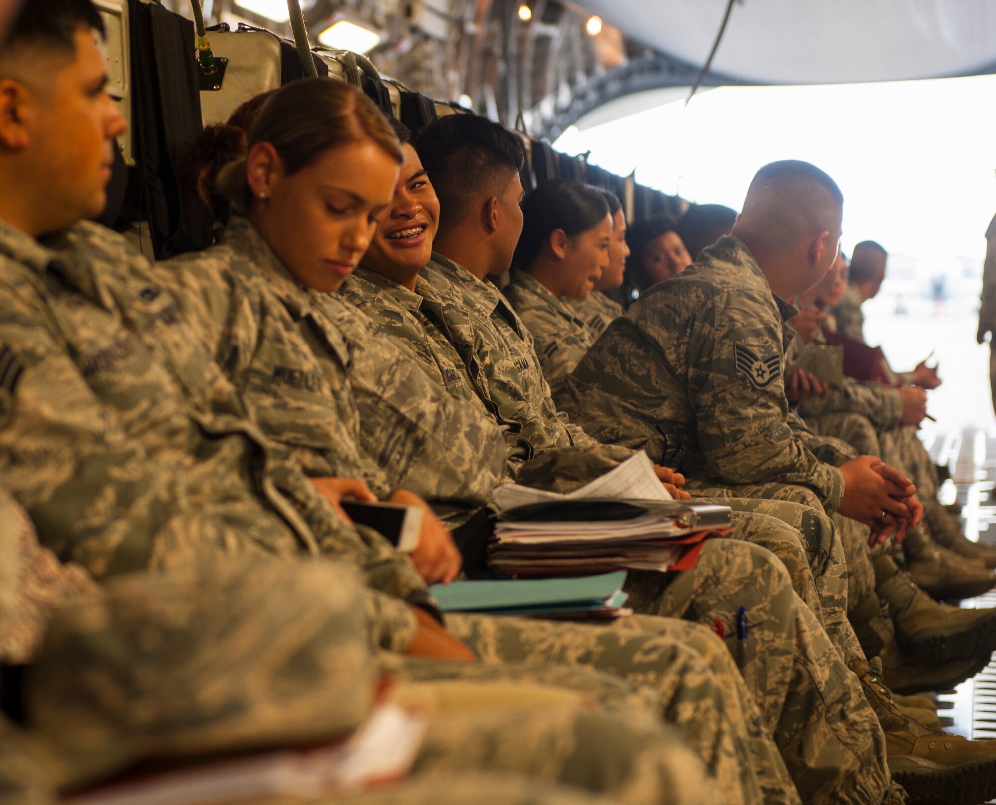 Airmen aboard a C-17 Globemaster III are headed to Wheeler Army Airfield, Hawaii for Exercise TROPIC THUNDER 2017 (XTT17), Joint Base Pearl Harbor-Hickam, Hawaii, April 19, 2017. XTT17 is a two part full spectrum readiness exercise hosted by the 15th Wing to test the individual, organizational and expeditionary readiness of the Airmen stationed at Hickam Field. (U.S. Air Force photo by Tech. Sgt. Heather Redman)