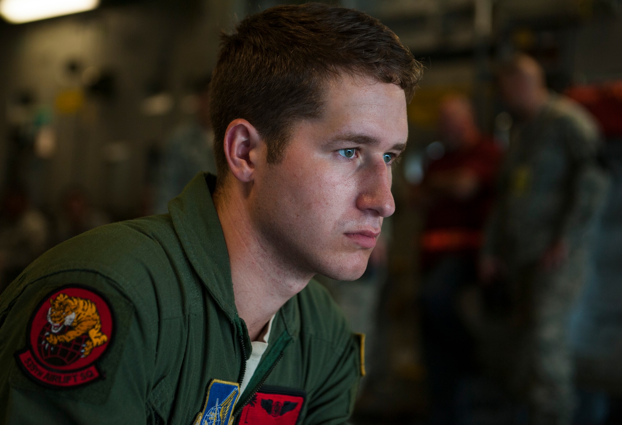 Airman 1st Class Trenton Turner, loadmaster assigned to the 535th Airlift Squadron, monitors cargo loading onto a C-17 Globemaster III during Exercise TROPIC THUNDER 2017 (XTT17), Joint Base Pearl Harbor-Hickam, Hawaii, April 19, 2017. XTT17 is a two part full spectrum readiness exercise hosted by the 15th Wing to test the individual, organizational and expeditionary readiness of the Airmen stationed at Hickam Field. (U.S. Air Force photo by Tech. Sgt. Heather Redman)
