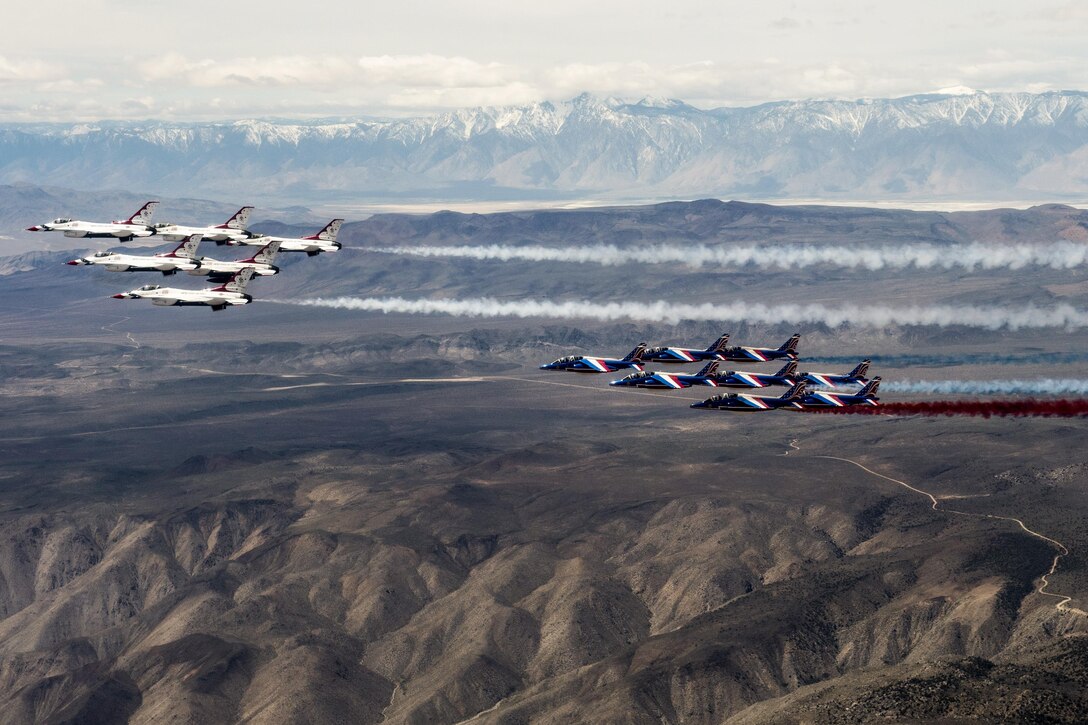 The Air Force Thunderbirds and Patrouille de France fly together over Death Valley, Calif., April 17, 2017. The Thunderbirds and Patrouille de France are two of the world's oldest aerial demonstration teams. Air Force photo by Tech. Sgt. Christopher Boitz