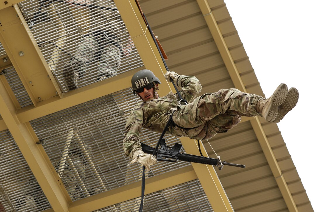 Army Spc. Dylan Gustaitis rappels off a tower as part of the air assault course at Camp Buehring, Kuwait, April 12, 2017. The 12-day class allows U.S. military personnel to become air assault qualified while deployed outside the continental United States. Army photo by Sgt. Tom Wade