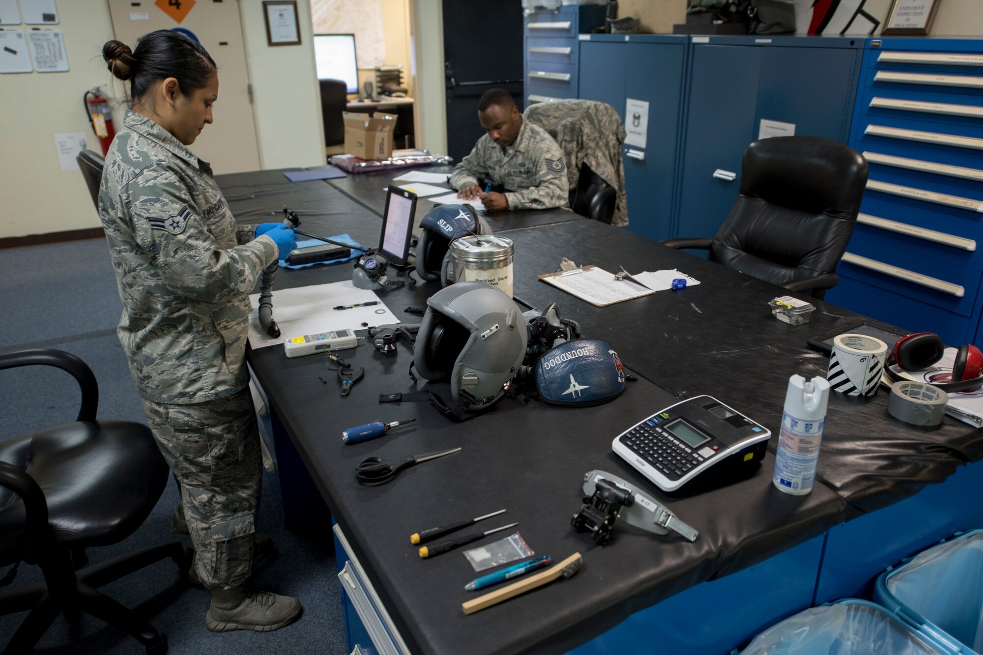 Aircrew flight equipment technicians from the 18th Operations Support Squadron reassemble a flight helmet April 18, 2017, at Kadena Air Base, Japan. The Airmen support F-15 Eagle operations within the 44th Fighter Squadron. (U.S. Air Force photo by Senior Airman John Linzmeier)
