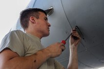 U.S. Air Force Airman 1st Class Quentin Freeman, 44th Aircraft Maintenance Unit crew chief, secures a panel on an F-15 Eagle April 19, 2017, at Kadena Air Base, Japan. The 44th AMU assists the 44th Fighter Squadron with preparations for realistic training and exercises, such as Exercise Vigilant Ace. (U.S. Air Force photo by Senior Airman Lynette M. Rolen)