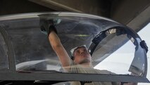 U.S. Air Force Airman 1st Class Quentin Freeman, 44th Aircraft Maintenance Unit crew chief, prepares the cockpit of an F-15 Eagle for flight April 19, 2017, at Kadena Air Base, Japan. Crew chiefs ensure pilots have optimum visibility when piloting their aircraft. (U.S. Air Force photo by Senior Airman Lynette M. Rolen)