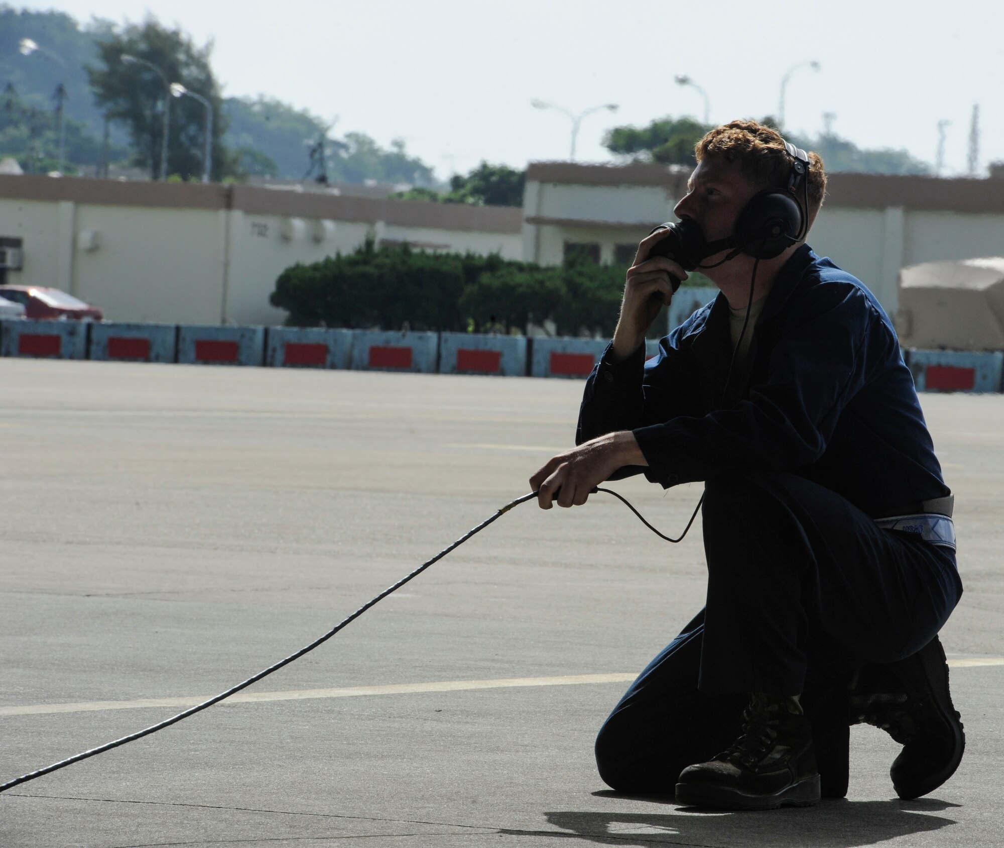 U.S. Air Force Airman 1st Class Locke Williams, 44th Aircraft Maintenance Unit crew chief, communicates with an F-15 Eagle pilot while conducting pre-flight checks April 19, 2017, at Kadena Air Base, Japan. Throughout pre-flight checks, crew chiefs maintain a constant line of communication with the pilot in order to ensure the process is running smoothly. (U.S. Air Force photo by Senior Airman Lynette M. Rolen)