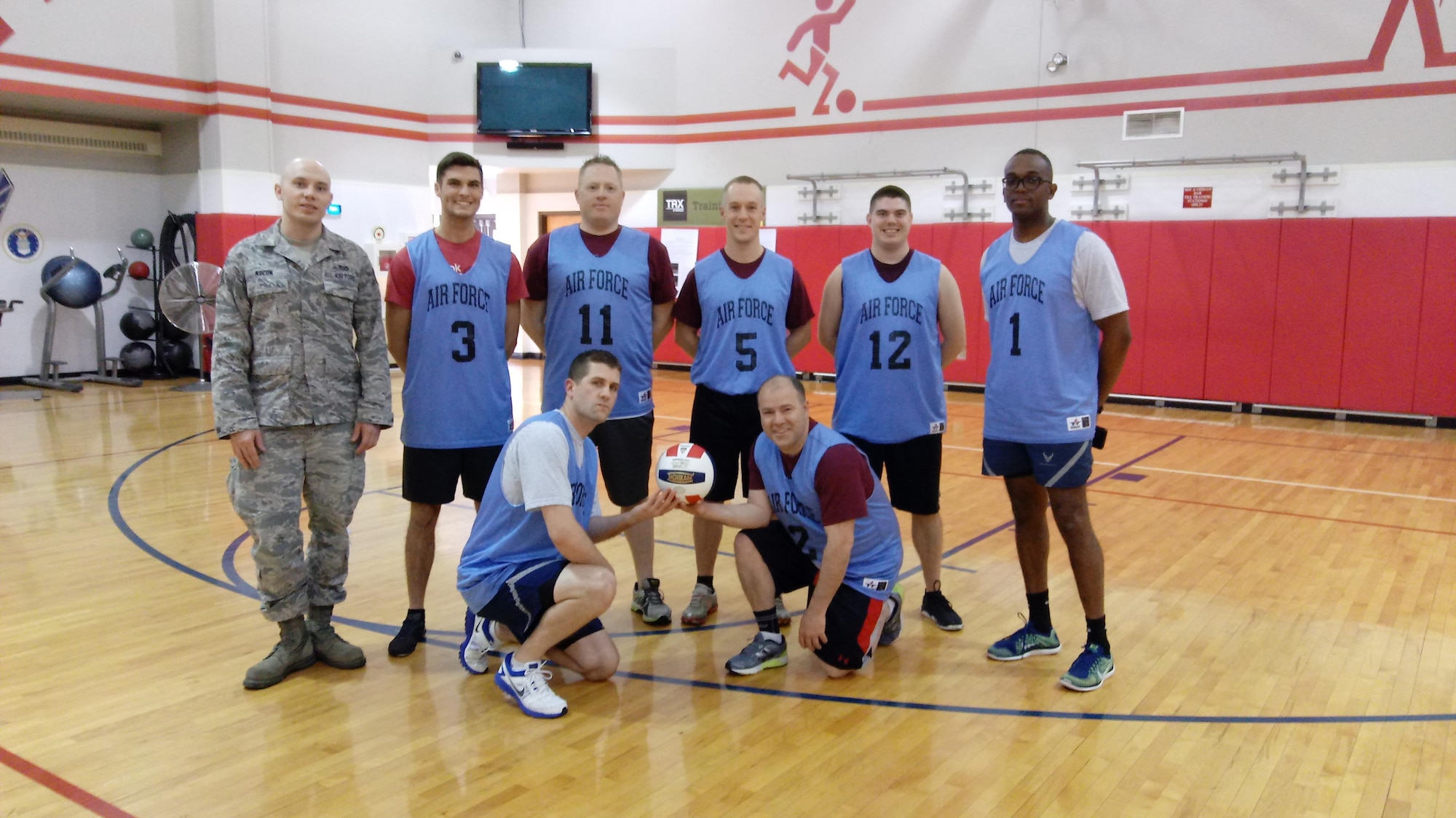 Members of the 911th Civil Engineer Squadron pose for a group photo April 8, 2017, at the 911th Airlift Wing Fitness Center, PIttsburgh International Airport Air Reserve Station, Pa. The 911th CES took first place in the 2017 Intramural Volleyball Tournament after a close 21-16 match with the 911th Aerial Port Squadron. (U.S. Air Force curtesy photo by Tamra Davis)