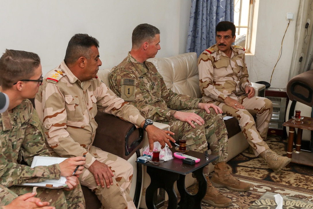 U.S. Army Maj. Gen. Joseph M. Martin, commanding general of Combined Joint Forces Land Component Command-Operation Inherent Resolve and 1st Infantry Division, discusses future operations for the liberation of Mosul with Staff Lt. Gen. Abdul Amir, commanding general, Iraqi ground forces, right, and Staff Lt. Gen. Qassim Jasim Nazal, commanding general, 9th Iraqi Armor Division, near Bakhira, Iraq, April 13, 2017. The Iraqi security forces commanders are partnered with leaders from the 2nd Brigade Combat Team, 82nd Airborne Division, deployed in support of Combined Joint Task Force-Operation Inherent Resolve, who enable their partners through the advise and assist mission, contributing planning, intelligence collection and analysis, force protection, and precision fires to achieve the military defeat of ISIS. CJTF-OIR is the global Coalition to defeat ISIS in Iraq and Syria. (U.S. Army photo by Staff Sgt. Jason Hull)