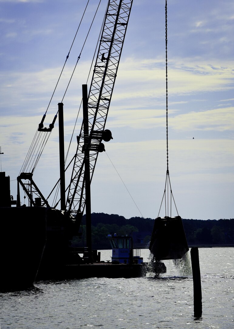 Contractors dredge a river during construction preparations for a new pier, which is used to receive jet fuel, at Joint Base Langley-Eustis, Va., April 17, 2017. The 733rd Logistics Readiness Squadron Fuels Facilities is overseeing the construction of the new pier, which, is expected to be completed in 18 months. (U.S. Air Force photo/Staff Sgt. Areca T. Bell)