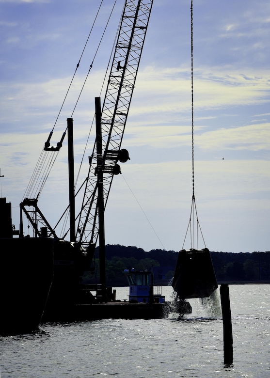 Contractors dredge a river during construction preparations for a new pier, which is used to receive jet fuel, at Joint Base Langley-Eustis, Va., April 17, 2017. The 733rd Logistics Readiness Squadron Fuels Facilities is overseeing the construction of the new pier, which, is expected to be completed in 18 months. (U.S. Air Force photo/Staff Sgt. Areca T. Bell)