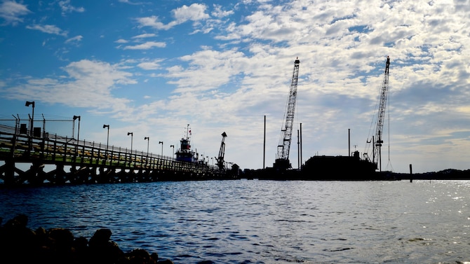 Contractors dredge the river during construction preparations for a new pier, which is used to receive jet fuel, at Joint Base Langley-Eustis, Va., April 17, 2017.  The new pier will be constructed out of concrete and will measure approximately 36 feet wide to give first responders access in times of emergency. (U.S. Air Force photo/Staff Sgt. Areca T. Bell)