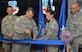 Brig. Gen. Peter Lambert, director of intelligence, Headquarters Air Combat Command, and Airman 1st Class Maggie, the youngest Airman assigned to the CTIC, 35th Intelligence Squadron, open the Cyberspace Threat Intelligence Center during the ribbon cutting ceremony Apr. 10. (U.S. Air Force photo by Lori Bultman)
