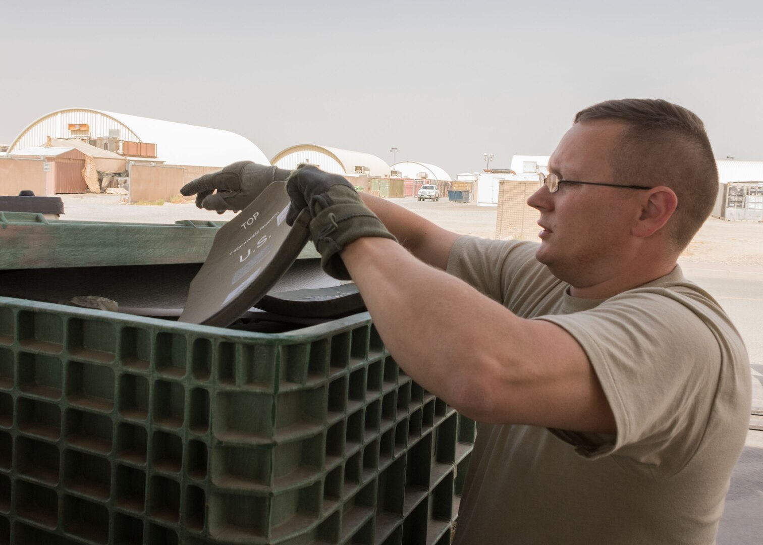 Master Sgt. Brian Donato, a 386th Expeditionary Logistics Readiness Squadron expeditionary theater distribution center section chief, explains the process for inspecting plates used in improved outer tactical vests at an undisclosed location in Southwest Asia April 19, 2017. When plates are returned to the ETDC they are sent off to be x-ray inspected for defects to ensure they are safe for reissue. (U.S. Air Force photo/Staff Sgt. Andrew Park)