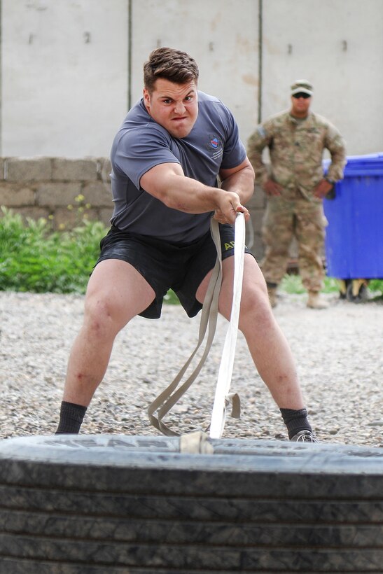 Army Spc. Bo Butler completes in a tire-pull relay during a strongman competition held at a tactical assembly area near Bakhira, Iraq, April 12, 2017. Butler is assigned to the 82nd Airborne Division’s 2nd Brigade Combat Team. Army photo by Staff Sgt. Jason Hull