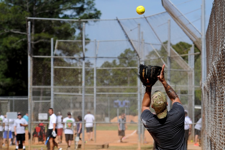 Michael Endrude, a third baseman with the 1st Special Operations Security Forces Squadron's softball team, catches a foul ball at Hurlburt Field, Fla., April 14, 2017. Endrude played during Battle of the Badges – a softball tournament in which police officers and firefighters from Okaloosa County and Hurlburt Field compete to be known as the 2017 Battle of the Badges champion.  (U.S. Air Force photo by Airman 1st Class Dennis Spain)