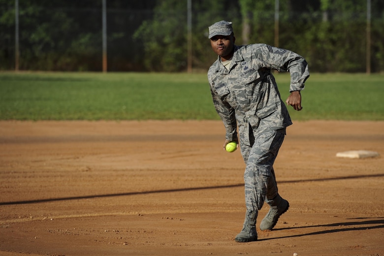 Chief Master Sgt. Robert Richardson, the superintendent of the 1st Special Operations Mission Support Group, throws the first pitch to kick off the Battle of the Badges softball tournament at Hurlburt Field, Fla., April 14, 2017. Police officers and firefighters from Hurlburt Field and Okaloosa County competed for the coveted softball championship. (U.S. Air Force photo by Airman 1st Class Dennis Spain)