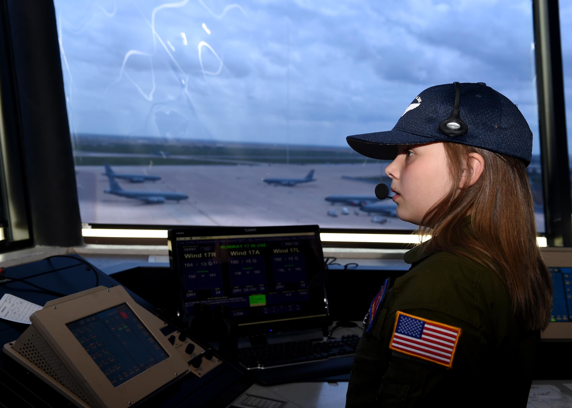 Maddy Hunt looks out at the Altus Air Force Base flightline during the Pilot for a Day Program at Altus AFB Oklahoma, April 14, 2017. The Pilot for a Day Program allows a child with a serious illness to tour the base and experience multiple aspects of Air Force life. (U.S. Air Force photo by SrA. Megan E. Myhre/Released)