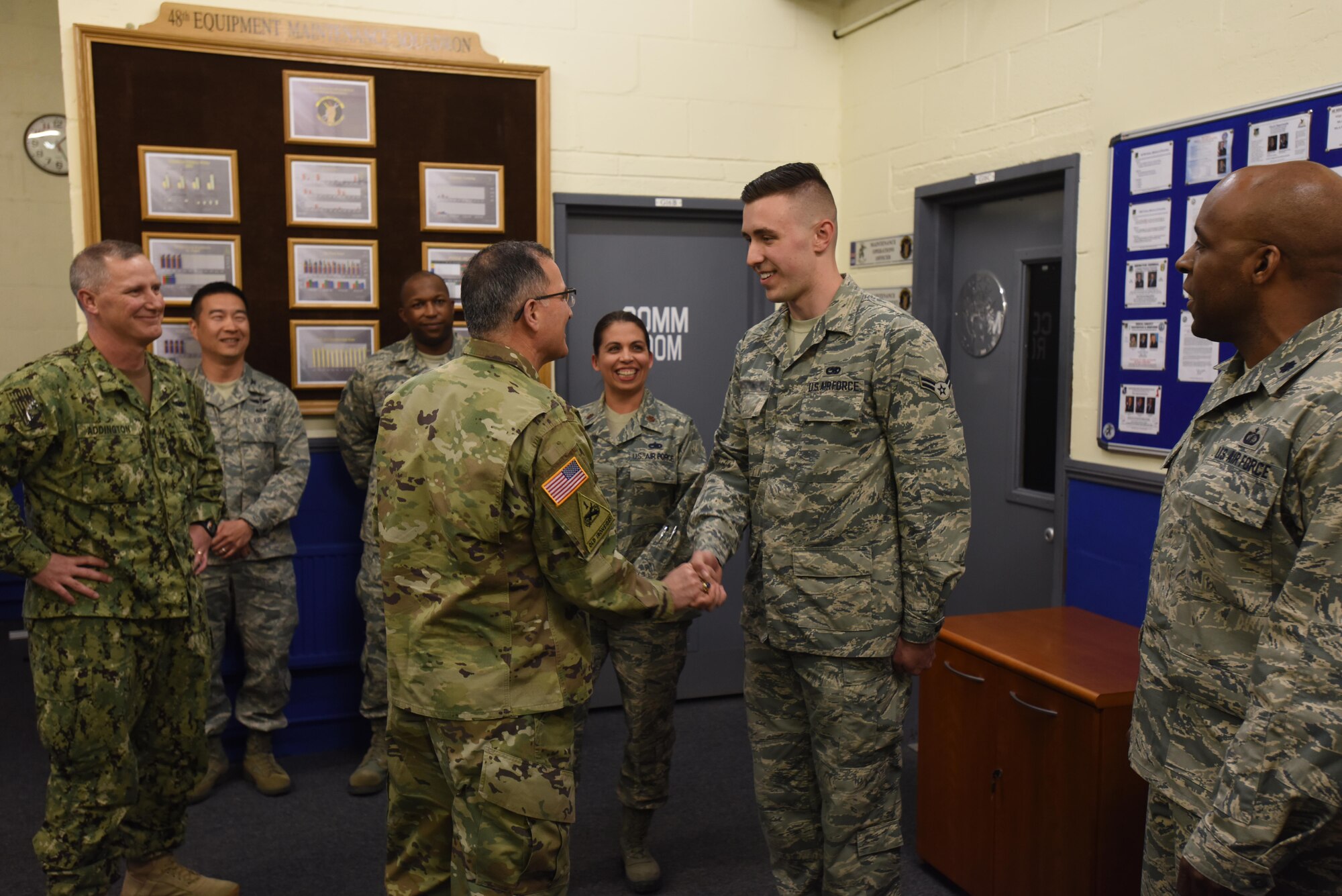 U.S. Army Gen. Curtis M. Scaparrotti, commander, U.S. European Command and NATO Supreme Allied Commander Europe, coins a member of the 48th Fighter Wing at Royal Air Force Lakenheath, England, April 19, 2017. During his visit, Scaparrotti spoke at an all-call for 48th Fighter Wing Airmen and visiting Airmen from Hill Air Force Base, Utah, who are participating in the first overseas training deployment of the F-35A Lightning II. (U.S. Air Force photo/Airman 1st Class Eli Chevalier)