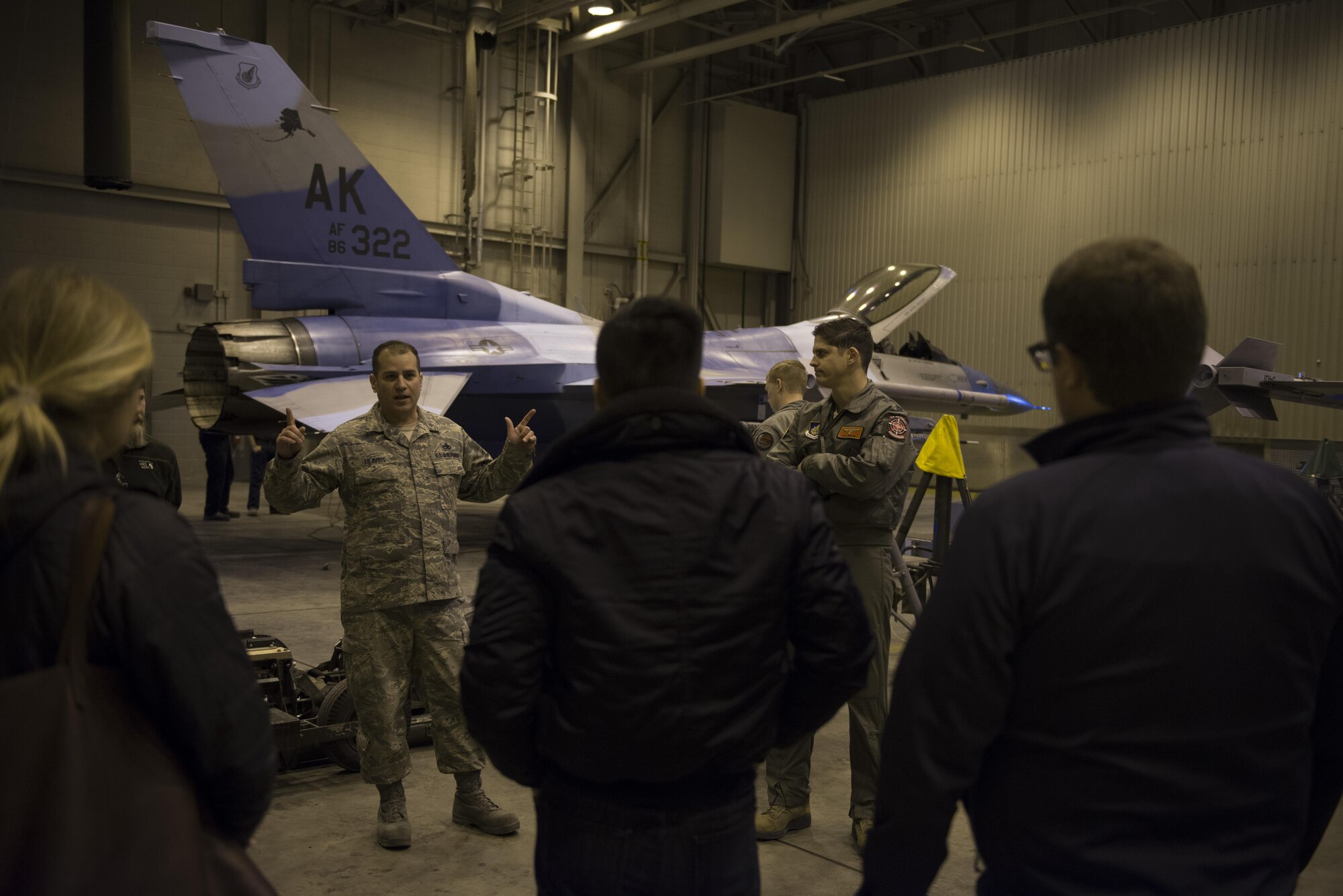 U.S. Air Force Master Sgt. David Lilavois, the 354th Aerospace Maintenance Group production superintendent, briefs congressional staff delegates on the F-16 Fighting Falcon aircraft 18 April, 2017, at Eielson Air Force Base, Alaska. The six delegates visited the installation to gain more information about the base’s operations and mission, both current and future. (U.S. Air Force photo by Airman Eric M. Fisher)