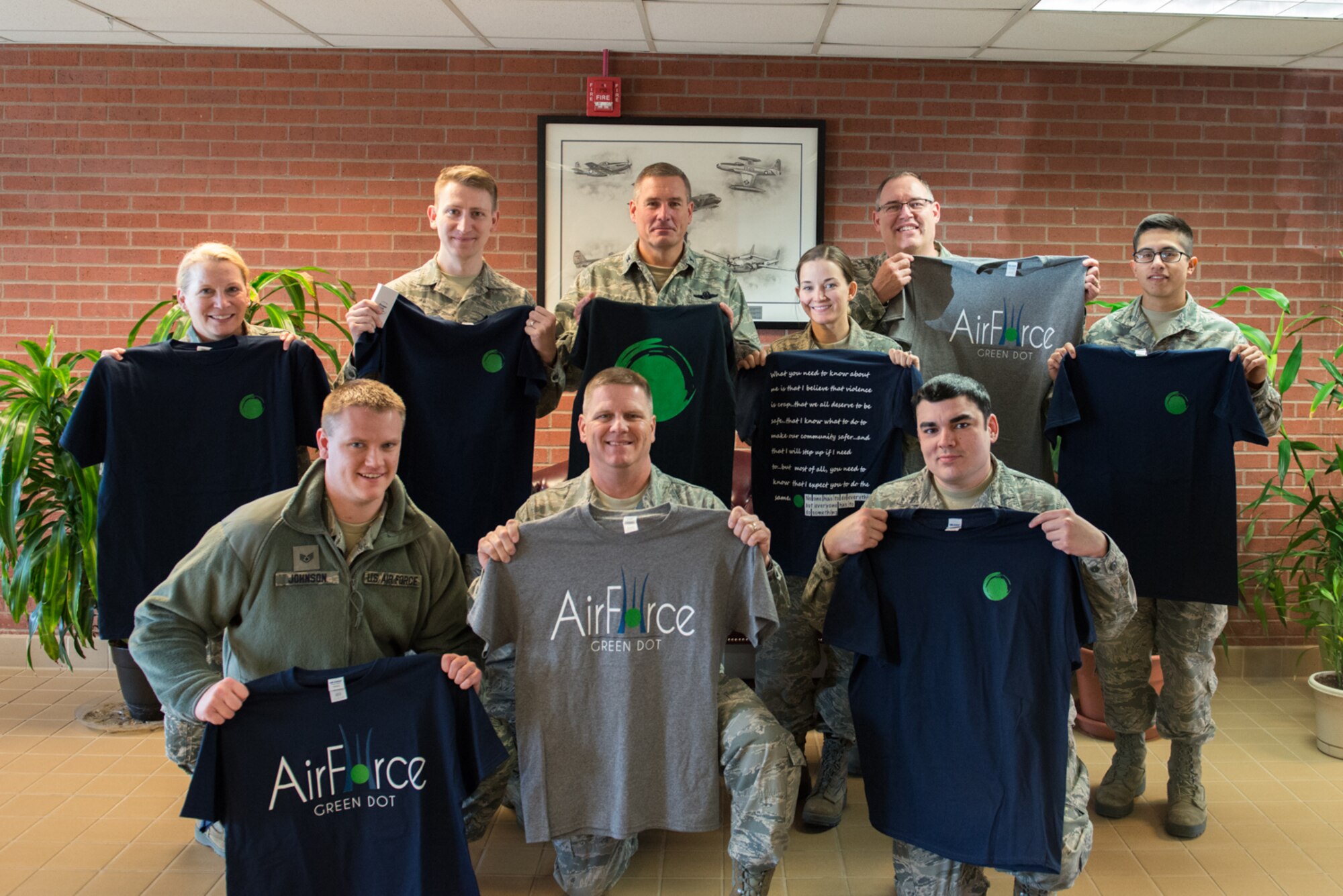 Members of the 934th Airlift Wing show off their Green Dot shirts after training April 1 at Minneapolis-St. Paul Air Reserve Station, Minn. (U.S. Air Force photo by Senior Airman Samuel Wacha)