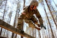 1st Lt. Justin Holloway, from the 12th Legal Operations Detachment, sails over an obstacle during the U.S. Army Reserve Legal Command's Best Warrior Competition at Fort A.P. Hill, Virginia
