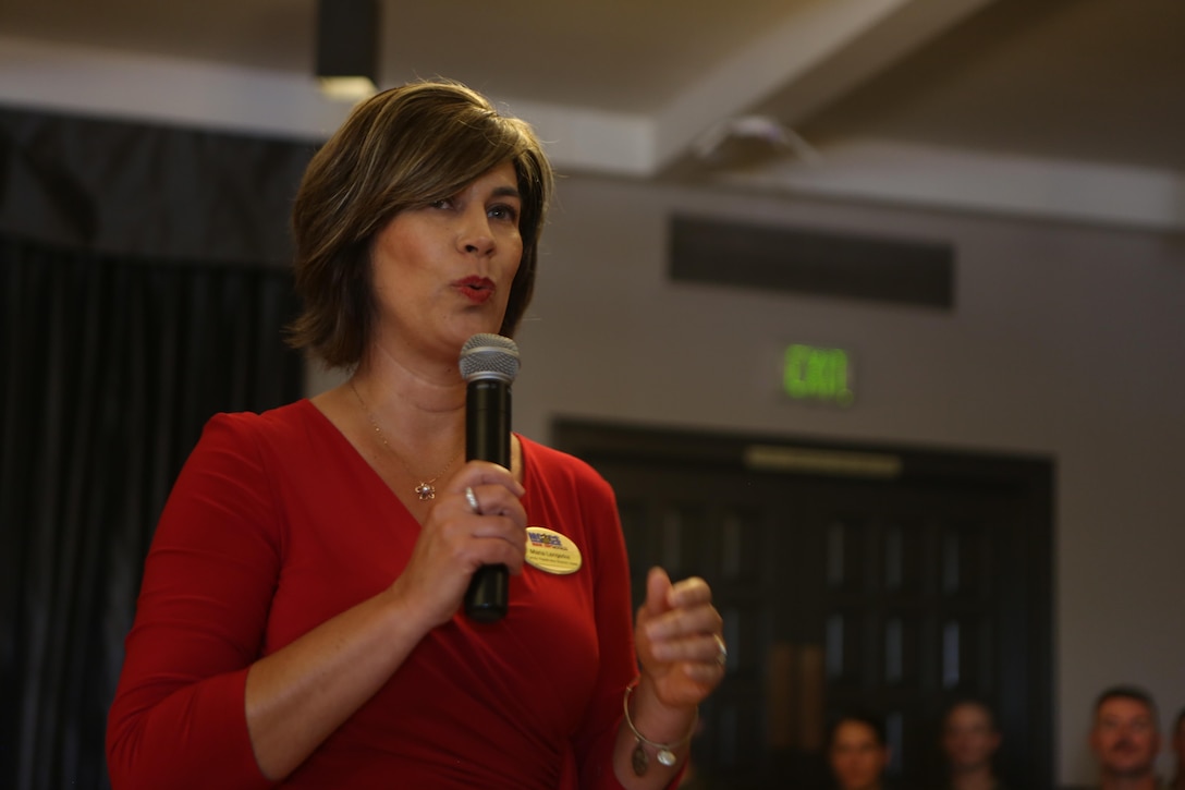 Maria Lengerke, the Marine Corps Air Station Miramar family readiness branch head, speaks to this year’s volunteers during the Marine Corps Community Services volunteer appreciation ceremony at MCAS Miramar, April 19. This year’s volunteer service celebration recognized the selfless acts of over 100 volunteers from around MCAS Miramar and the surrounding community whose volunteer work saved over one million four-hundred thousand dollars of labor pay. (Marine Corps photo by Sgt. David Bickel/Released)