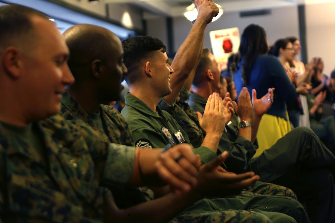 Service members from Marine Heavy Helicopter Squadron (HMH) 361, “Flying Tigers,” cheer for their unit volunteers during the Marine Corps Community Services volunteer appreciation ceremony at MCAS Miramar, April 19. This year’s volunteer service celebration recognized the selfless acts of over 100 volunteers from around MCAS Miramar and the surrounding community. (Marine Corps photo by Sgt. David Bickel/Released)