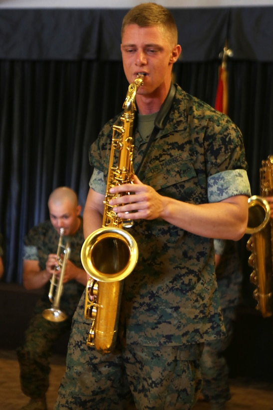 Cpl. Allen West, a saxophone player for the 3rd Marine Aircraft Wing band, plays a solo for the volunteers and guests celebrating the Marine Corps Community Services volunteer appreciation ceremony at Marine Corps Air Station Miramar, April 19. This year’s volunteer service celebration recognized the selfless acts of over 100 volunteers from around MCAS Miramar and the surrounding community. (Marine Corps photo by Sgt. David Bickel/Released)