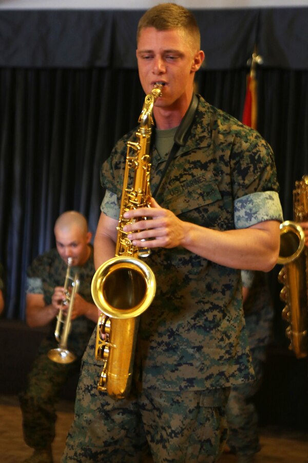 Cpl. Allen West, a saxophone player for the 3rd Marine Aircraft Wing band, plays a solo for the volunteers and guests celebrating the Marine Corps Community Services volunteer appreciation ceremony at Marine Corps Air Station Miramar, April 19. This year’s volunteer service celebration recognized the selfless acts of over 100 volunteers from around MCAS Miramar and the surrounding community. (Marine Corps photo by Sgt. David Bickel/Released)