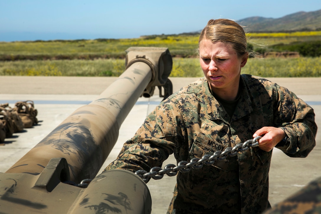 Marine Corps Lance Cpl. Caitlin McCoy secures chains to an M777 howitzer during integrated slingload training at Marine Corps Base Camp Pendleton, Calif., April 12, 2017. McCoy is a landing support specialist assigned to Combat Logistics Battalion 15, 15th Marine Expeditionary Unit. Marine Corps photo by Cpl. Frank Cordoba