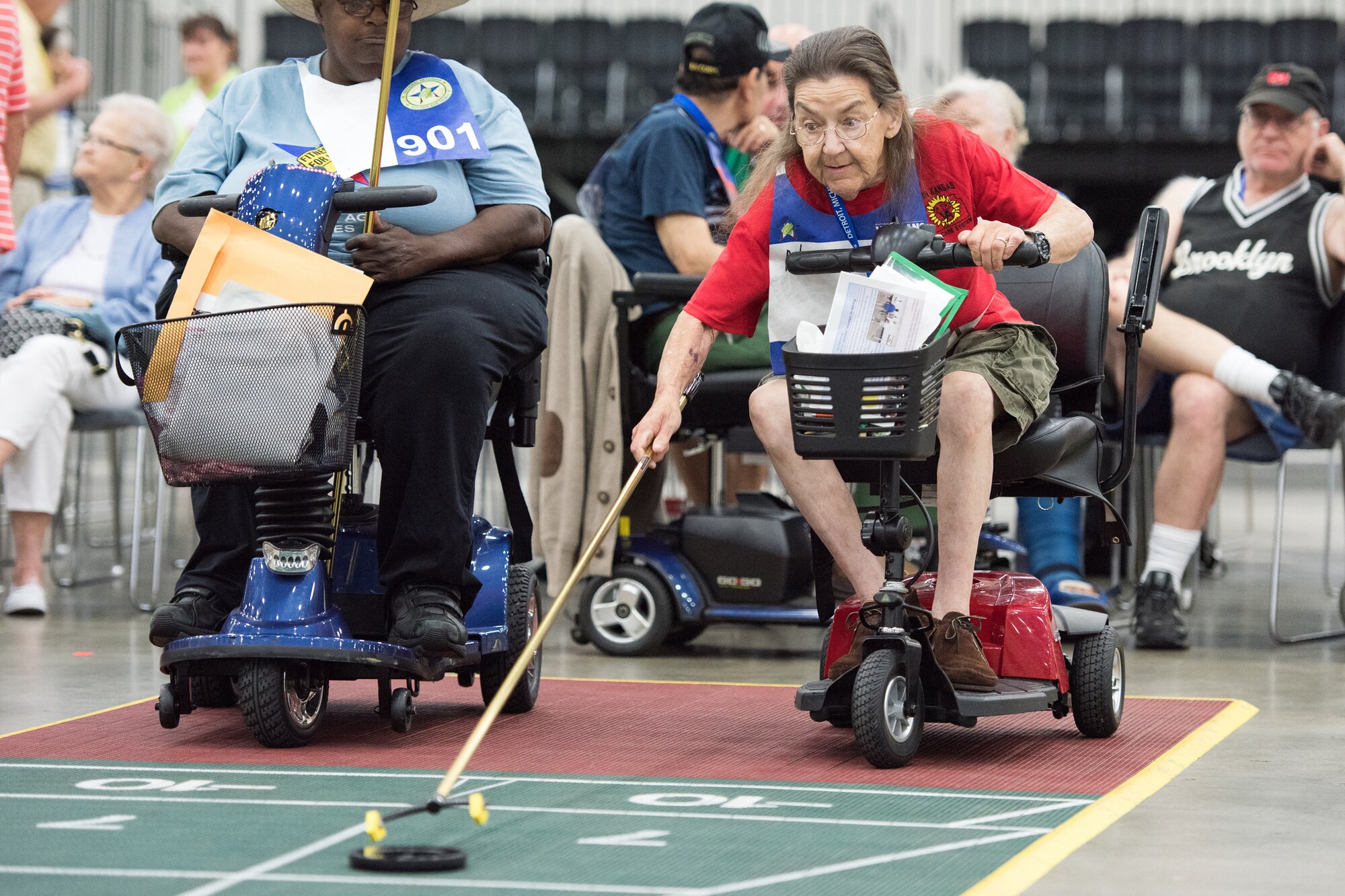 A veteran lines up her shot during a shuffleboard competition during the 2016 National Veterans Golden Age Games in Detroit. The 2017 NVGAG will take place from May 7-11, 2017, in Biloxi, Miss. Credit: (Veterans Affairs photo)
