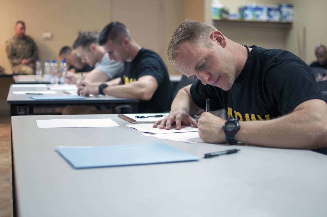Sgt. Damien Jorgenson, a 485th Military Police Company Soldier, takes a written exam during the 1st Sustainment Command (Theater), Best Warrior Competition, at Camp Arifjan, Kuwait April 14th, 2017.
(US Army Photo by Sgt. Christopher Bigelow)