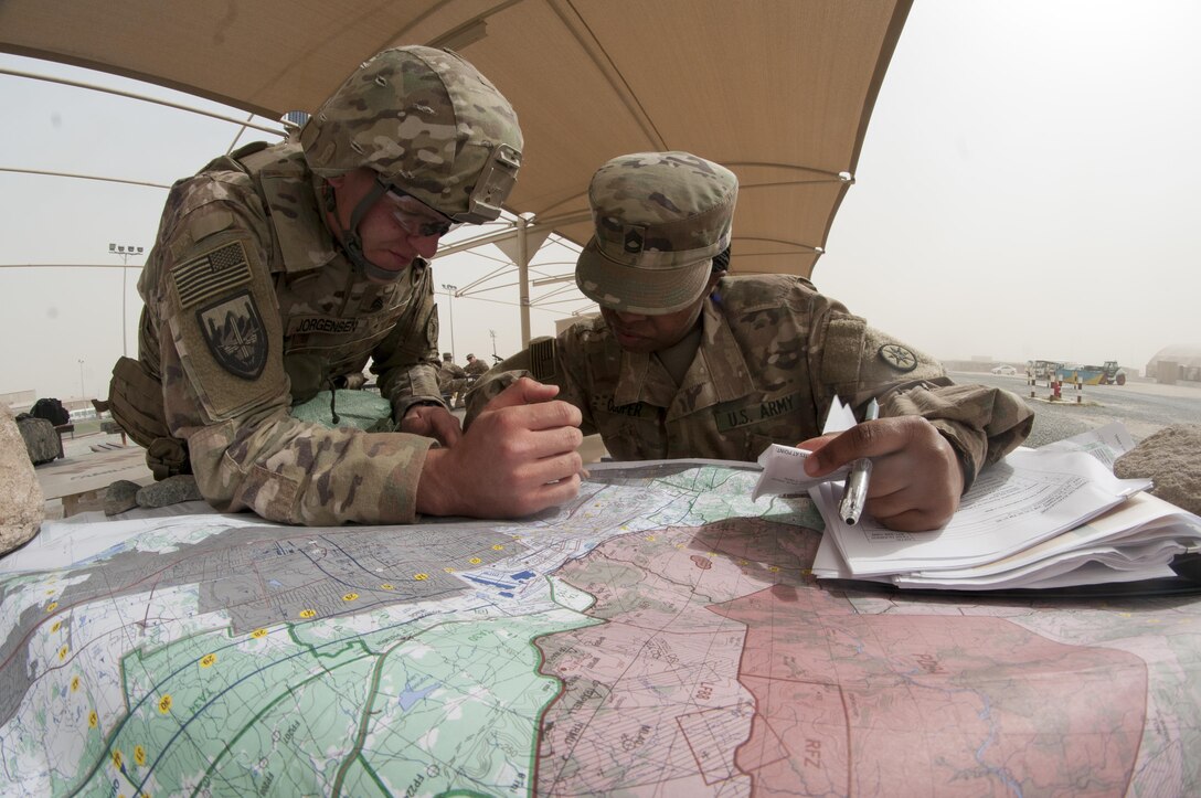 Sgt. Damien Jorgenson, a Soldier with the 485th Military Police Company, has his map reading skills graded during the 1st Sustainment Command (Theater) Best Warrior Competition 10-mile ruck march April 16th, 2017.
(US Army Photo by Sgt. Christopher Bigelow)