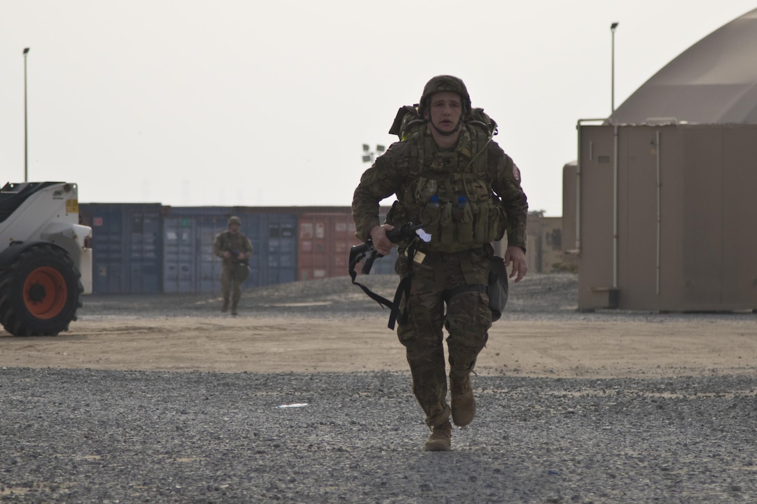 Spc. Jesse Skaggs, with Task Force Sinai, runs during the ten-mile ruck march during the 1st Sustainment Command (Theater) Best Warrior Competition at Camp Arifjan, Kuwait, April 15, 2017. (U.S. Army Photo by Staff Sgt. Dalton Smith)