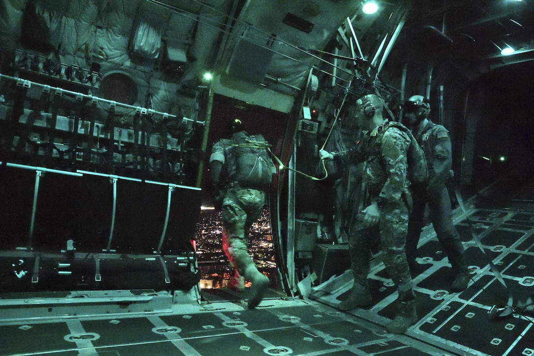 Air Force special operations survival, evasion, resistance and escape specialists jump from a C-130 Hercules aircraft during a high altitude low opening parachute drop over Yokota Air Base, Japan, April 13, 2017. Air Force photo by Machiko Arita