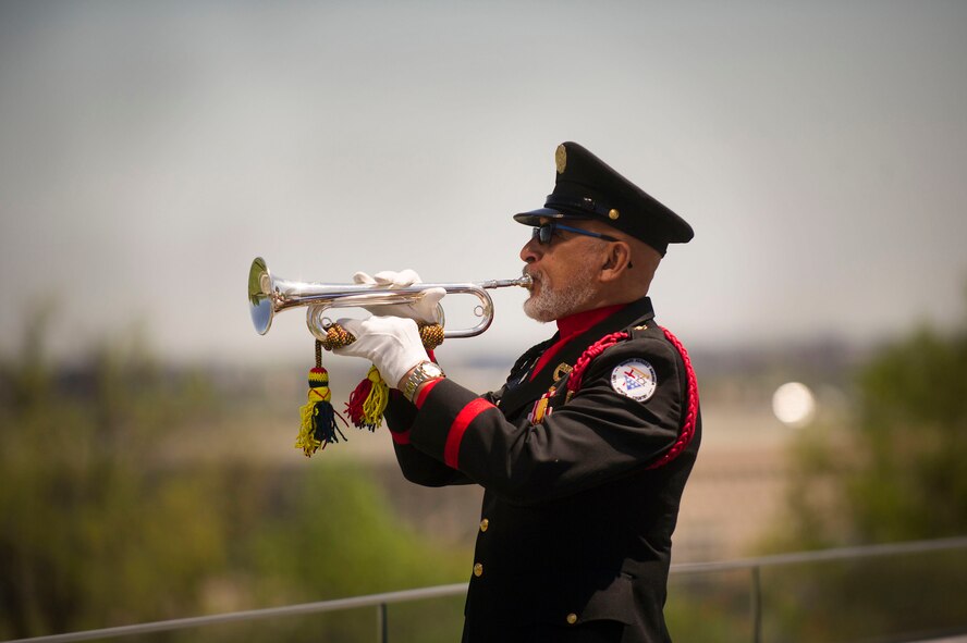 Mr. Auston O'Neill from Bugles Across America plays Taps during a wreath laying ceremony at the Air Force Memorial in Arlington, Va., honoring the 75th Anniversary of the Doolittle Tokyo Raid Apr. 18, 2017. (Photo by Senior Master Sgt. Adrian Cadiz)(Released)