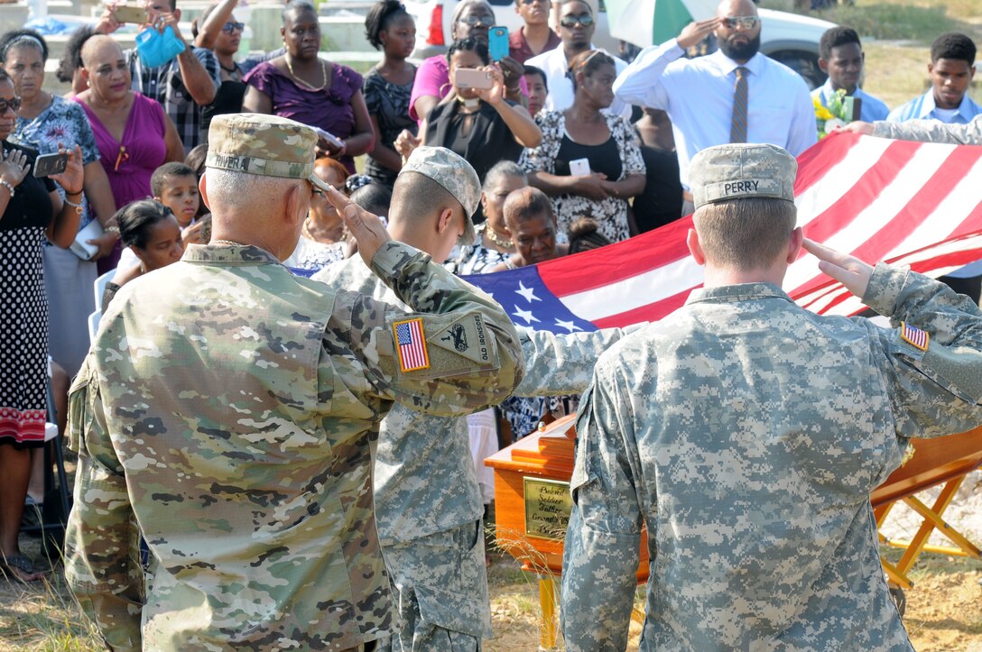 Command Sgt. Maj. Angel Rivera, a reservist from Puerto Rico's 210th Regional Support Group, leads a funeral detail with Beyond the Horizon 2017-Belize Soldiers in rendering honors to retired Master Sgt. David Daniel Alexander Pandy Jr., who passed away, at a cemetery in Ladyville, Belize on March 30, 2017. BTH 2017 is a U.S.-Belize partnership exercise encompassing three health care events and five construction projects designed to improve the health and education infrastructure of Belizean communities.
