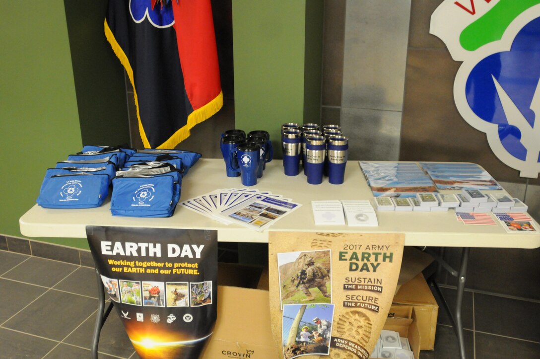 A display table at the 88th Regional Support Command Headquarters in Fort McCoy, Wisconsin, is filled with handouts and information about Earth Day activities across the 19-state region. Earth Day is April 22 and the 88th RSC is honoring that day by providing reusable coolers and travel mugs as well as information about how to be better stewards of the environment.