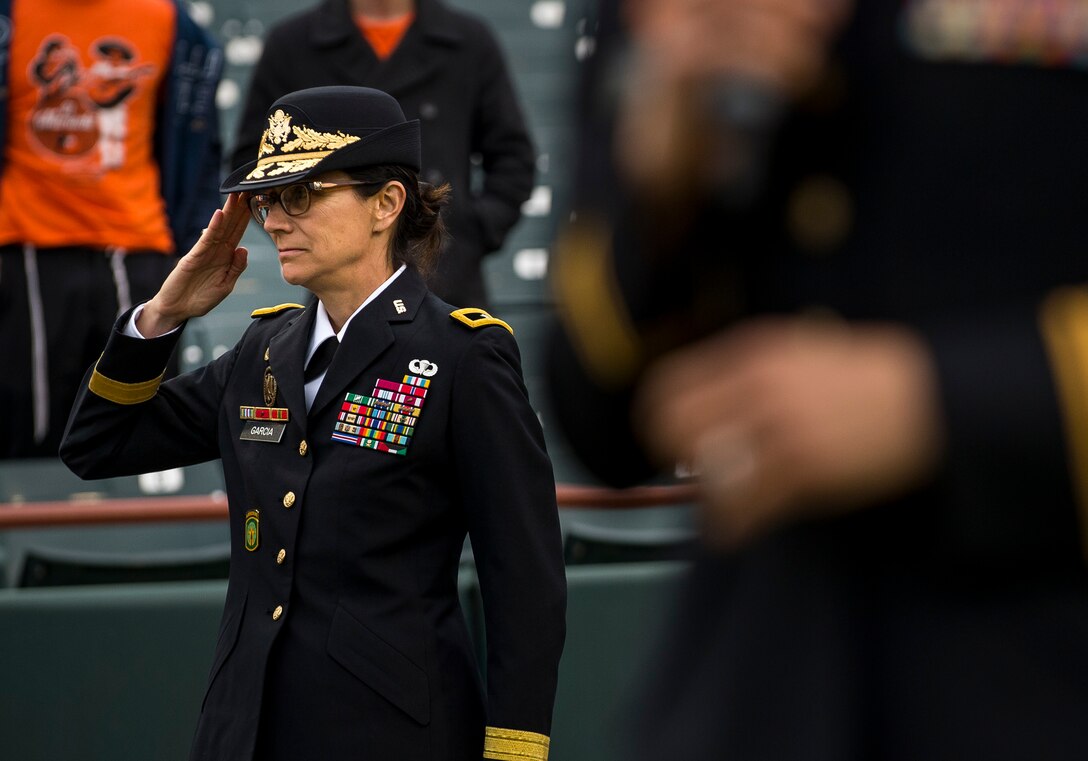 Brig. Gen. Marion Garcia, U.S. Army Reserve commanding general of the 200th Military Police Command, headquartered at Fort Meade, Md., salutes during the national anthem before a celebration game for the Army Reserve's 109th birthday at Prince George's Stadium, April 19, 2017. The 200th MP Cmd. is located less than 20 miles from the stadium, and sought this opportunity to engage with the local community. The U.S. Army Reserve's official birthday is on April 23. (U.S. Army Reserve photo by Master Sgt. Michel Sauret)