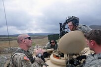 U.S. Army Reserve Sgt 1st Class Christopher Trammell, 450th Engineer Company, 478th Engineer Battalion, 926th Engineer Brigade, 412th Theater Engineer Command, based in Fort Thomas, Ky., left, offers some tips to a M113 Armored Personnel Carrier gun crew during a Gunnery crew live-fire qualification at Wilcox Range on Fort Knox, Ky., March 27, 2017. They are Spc. Matthew Reed, left, Sgt. Brandon Kincaid and Spc. Dalton Phillips and all are with the 979th Mobility Company, 478th Engineer Battalion, 926th Engineer Brigade, 412th Theater Engineer Command based in Lexington, Ky. This is the first time that this company has fired its M2s and M240B machine guns from M113 Armored Personnel Carriers. (U.S. Army Reserve Photo by Sgt. 1st Class Clinton Wood)